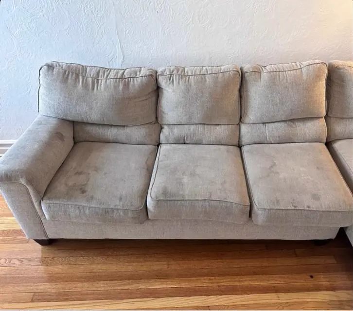 Before cleaning: linen-look three-seat sofa