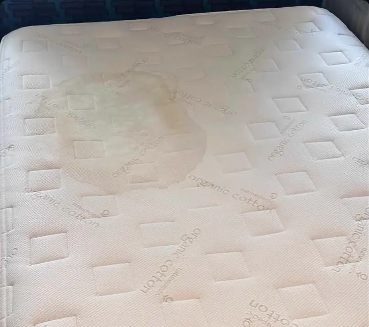 Before cleaning: mattress with stains