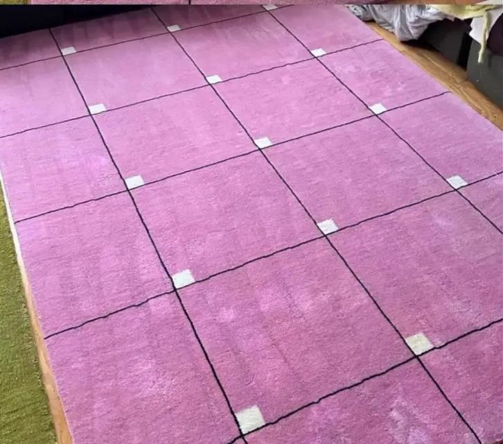 After cleaning: pink geometric area rug