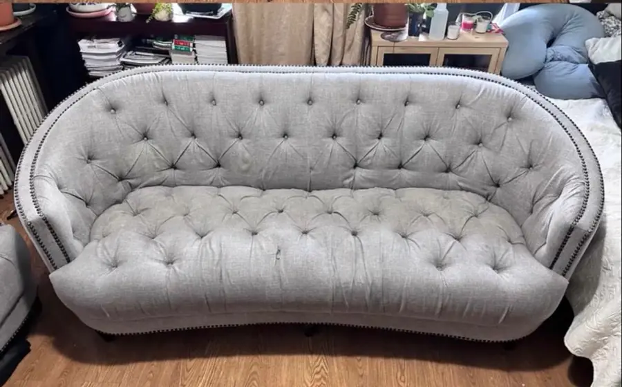After cleaning: tufted gray loveseat